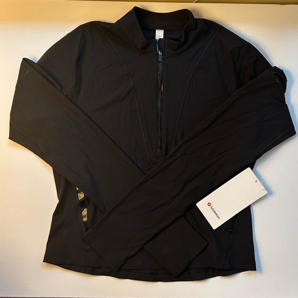 New with tags. Lululemon. Glass trim run 1/2 zip. Black. Size 10